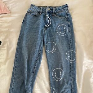 smiley face painted blue jeans